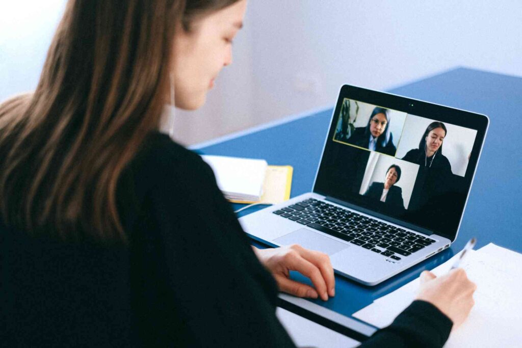 A remote worker participating in a video meeting with their colleagues.